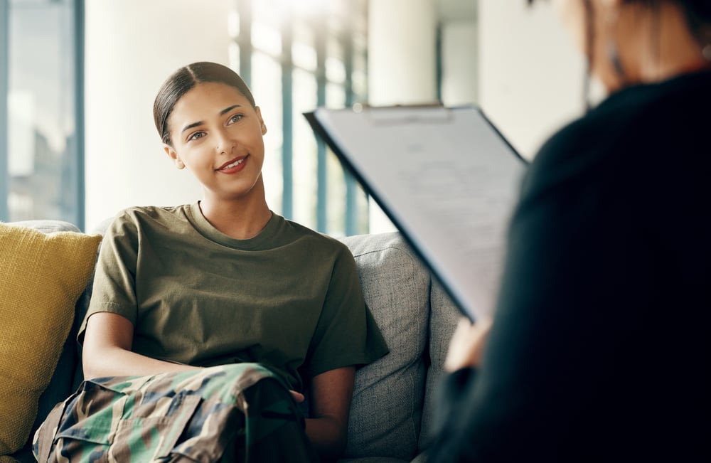 a woman veteran that is happy that she finished her addiction treatment and is now living a new sober life