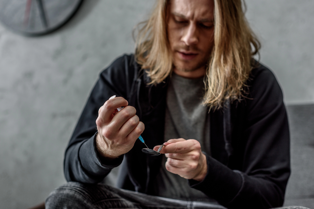 addicted man who needs addiction treatment in texas
