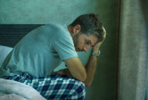 Man experiencing symptoms of alcohol poisoning