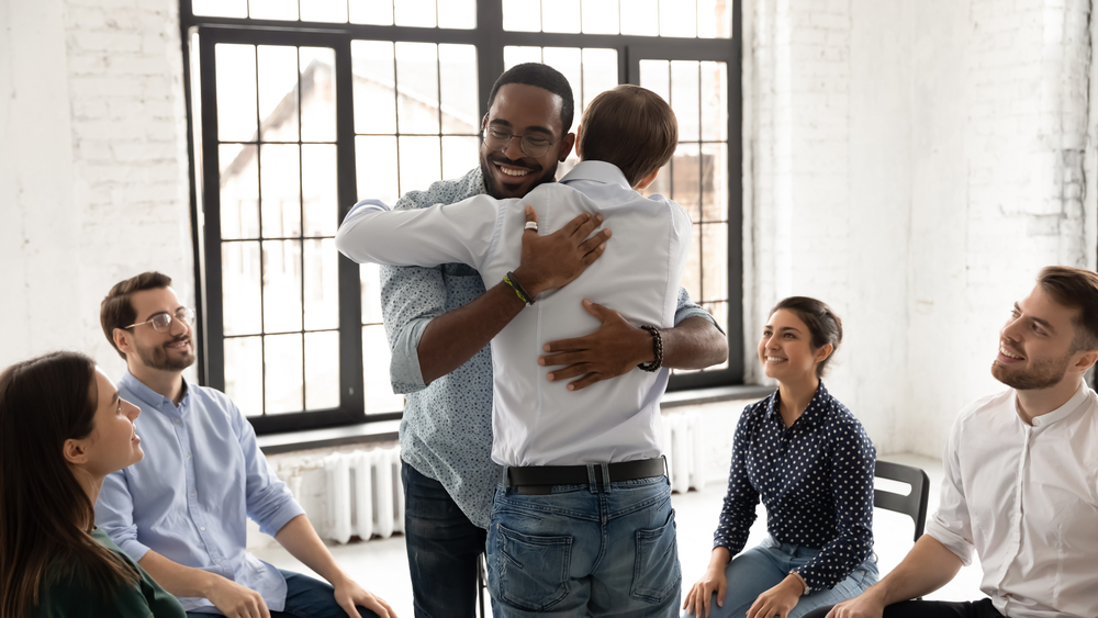 image representing the benefits of attending a support group with their two participants getting emotional support from each other
