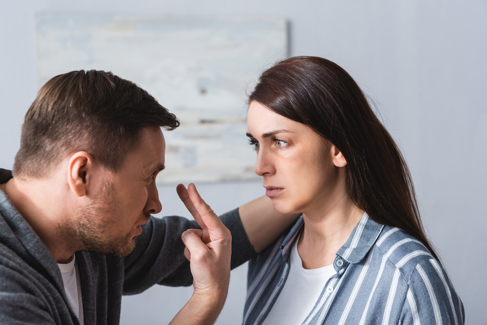 man abusing wife - verbal abuse and physical abuse