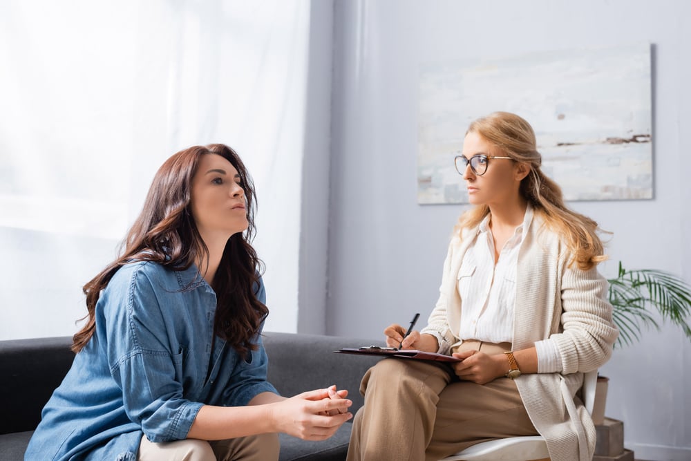 a patient and a mental therapist having conversation