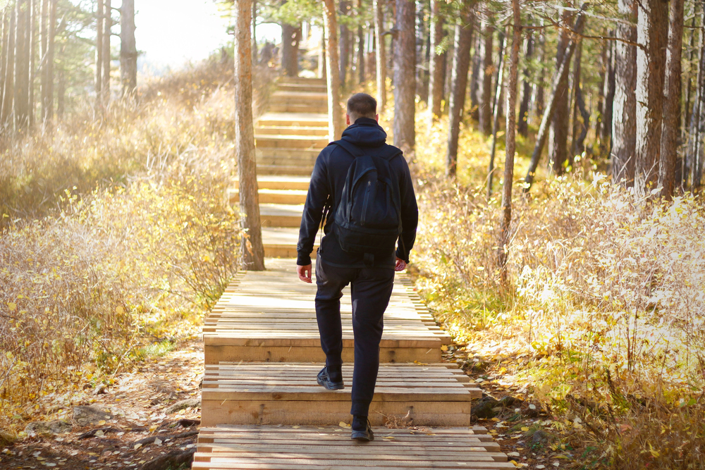 Man on stairway taking first steps toward recovery