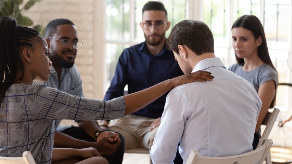 Man in Group therapy under residential treatment prgoram