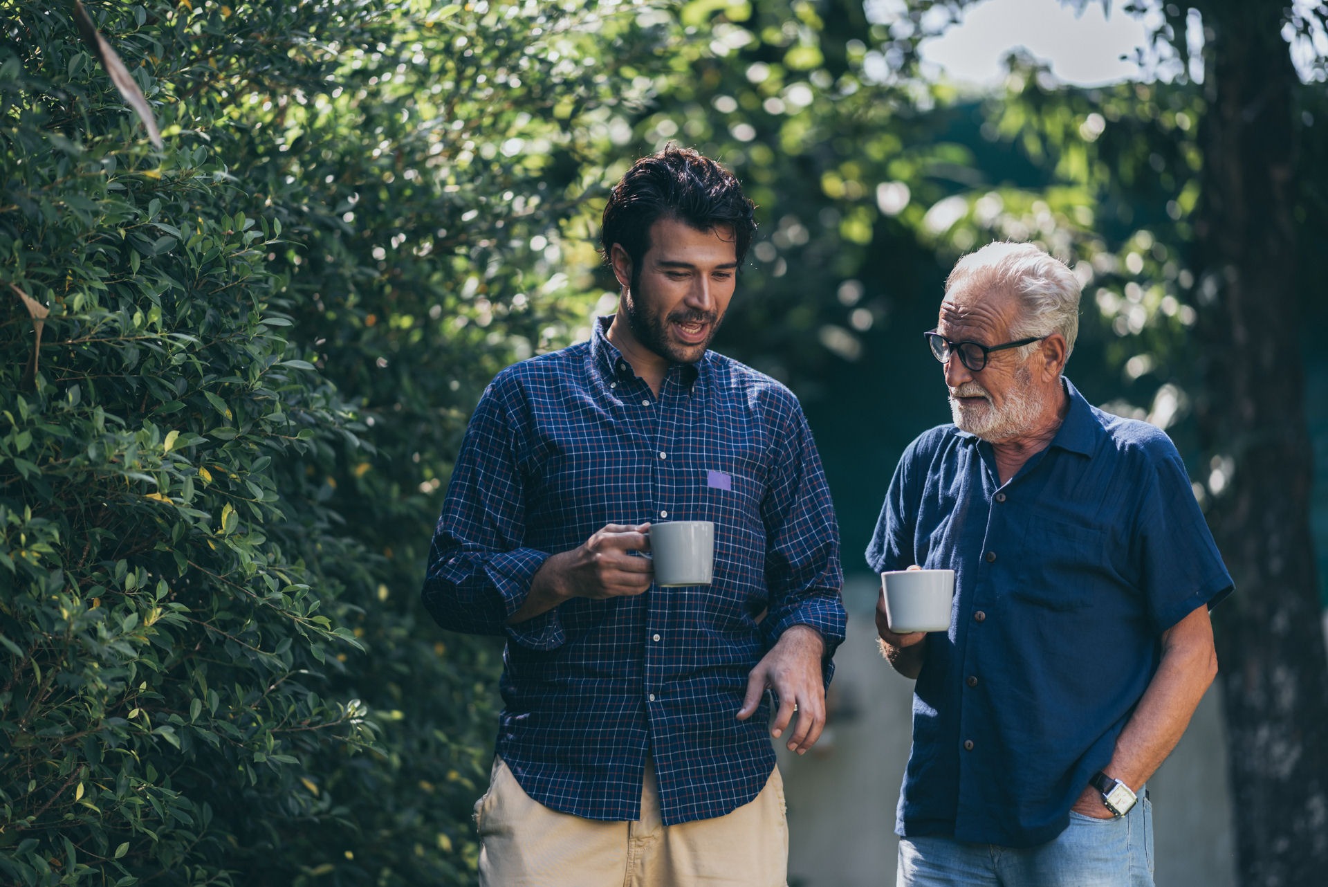 Two men with coffee cups discuss how long it takes to break an addiction